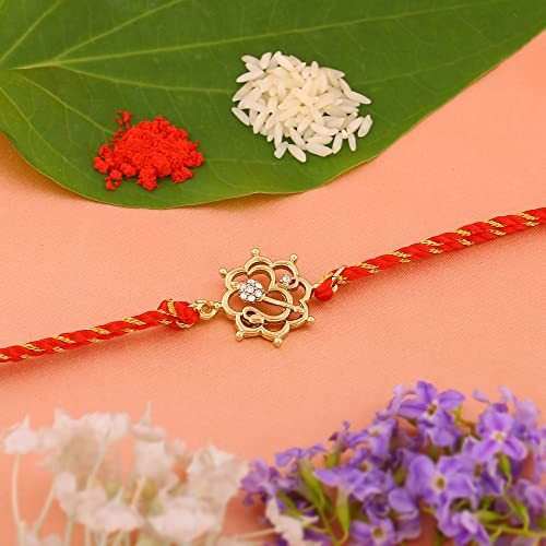Estele Gold Plated Floral Om Bracelet With Austrian Crystals And Divine Red Silk Thread For Men