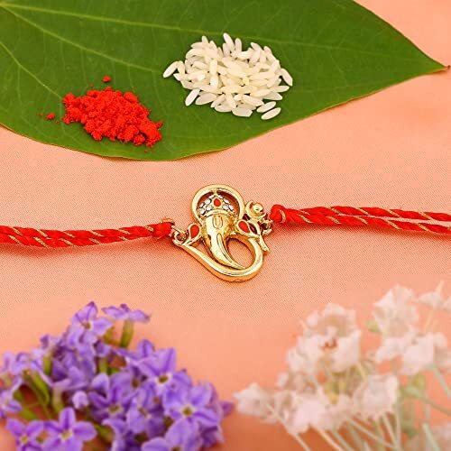 Estele Gold Plated Om Ganesh Bracelet With Austrian Crystals, Enamel And Divine Red Silk Thread For Men