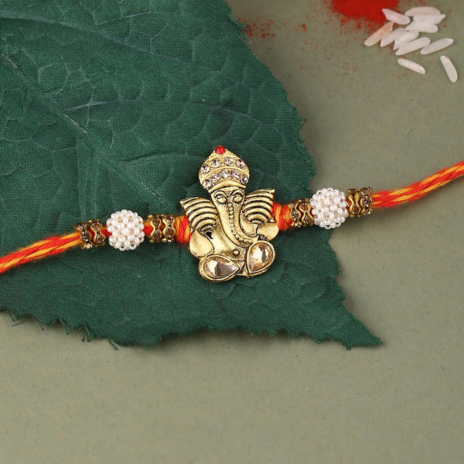 Voylla Antique Lord Ganesha Rakhi With Roli Chaawal Pack Multicolour