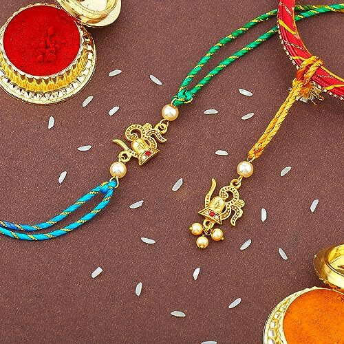 Estele Gold Plated Divine Lord Shiva With Om Symbol Rakhi Set For Bhaiya & Bhabhi With Pearls And Multi-Colored Silk Thread