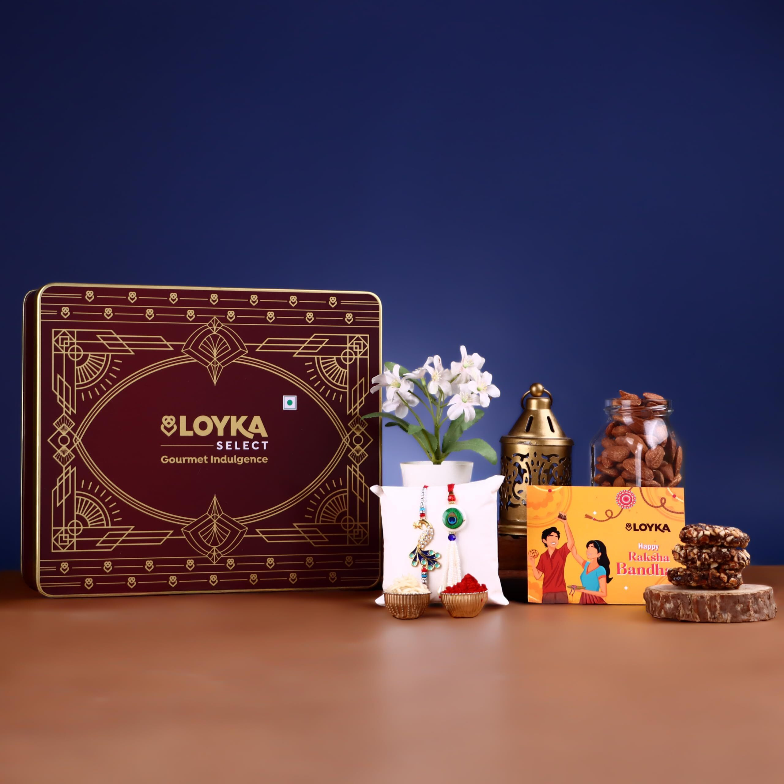 Loyka Select Regal Tin (Reusable) With Bhaiya Bhabhi Rakhi, Roli, Chawal & Card  A Luxurious Gifting Delight With 5 Almond Brittle Gold, 5 Brownie, 8 Pops, 6 Cookies & Rich Dark Chocolate Almond Treats  Perfect For Celebrations & Special Moments