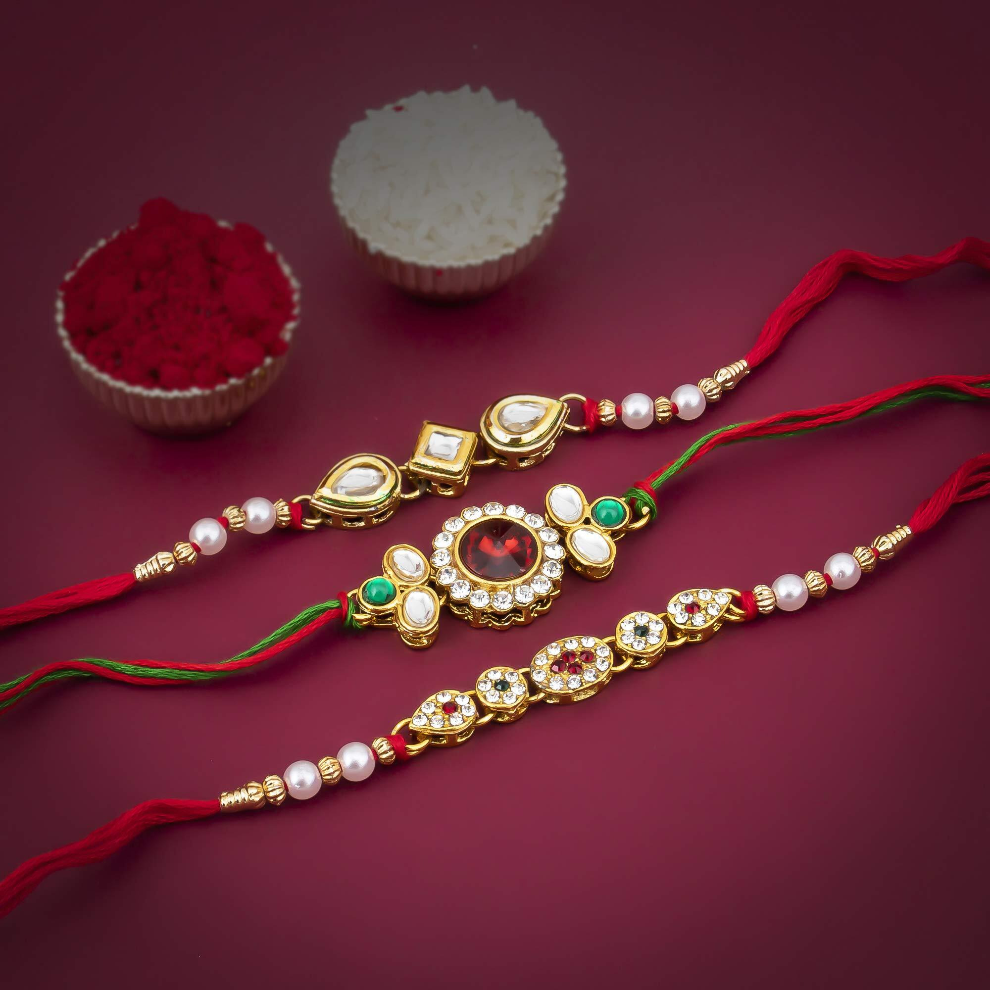 Sukkhi Rakhi Spunky Kundan Rakhi Combo & Designer Gold Plated Premium Rakhi For Brother, Roli Chawal & Greeting Card|Rakhi For Bhaiya|Rakhi For Men|Kundan Rakhi|Rakhi Combo-Set Of 3 |Cbrak82920