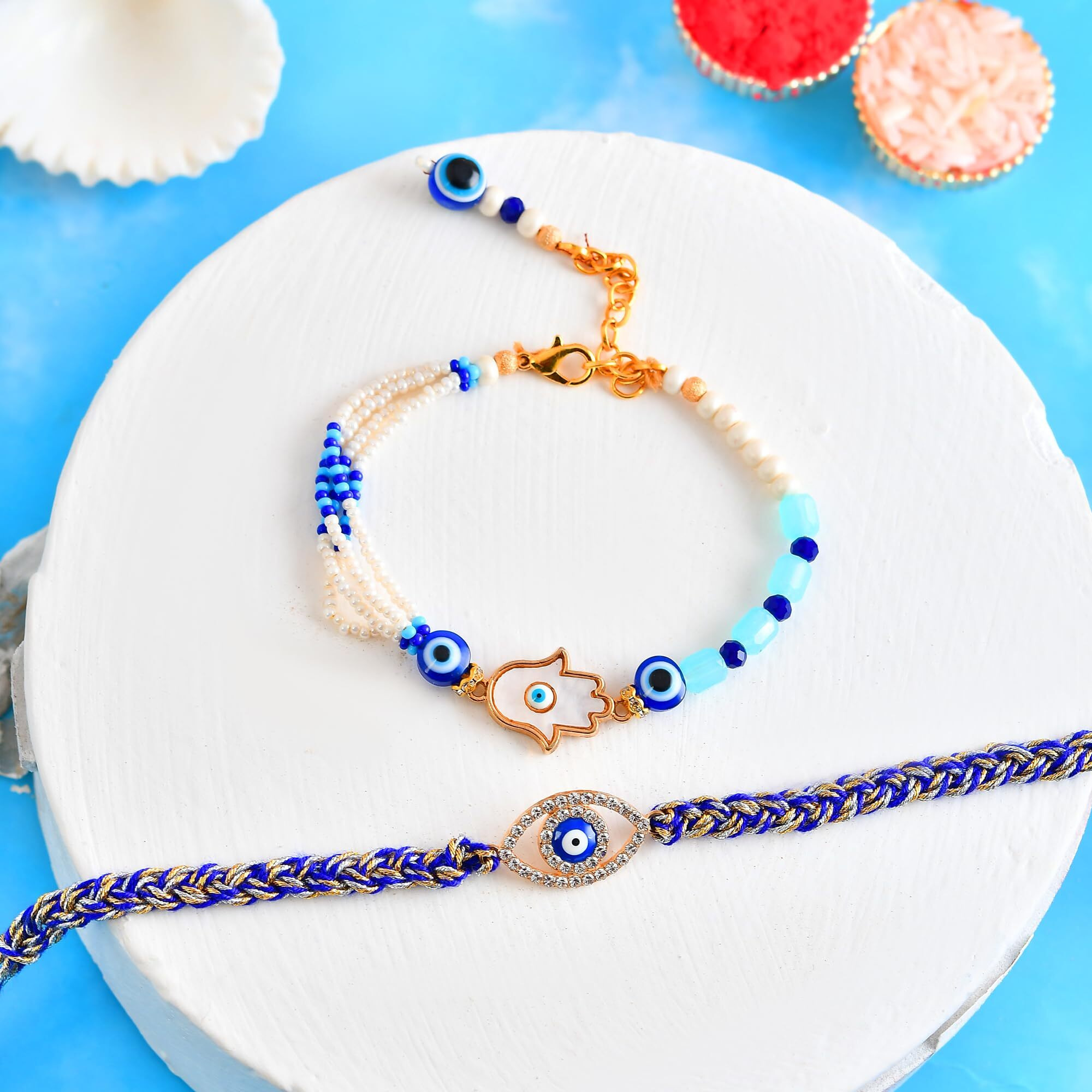 Craftvatika Evil Eye Bracelet Rakhi Set For Brother And Bhabhi, Rakhi Set Of 2, Hamsa Hand Bhaiya Bhabhi Couple Pair Rakhis Designer Premium Rakhis Bhabhi For Rakshabandhan, Rakshasutra For Women Men,Best Wishes Greeting Card, Tilak Set