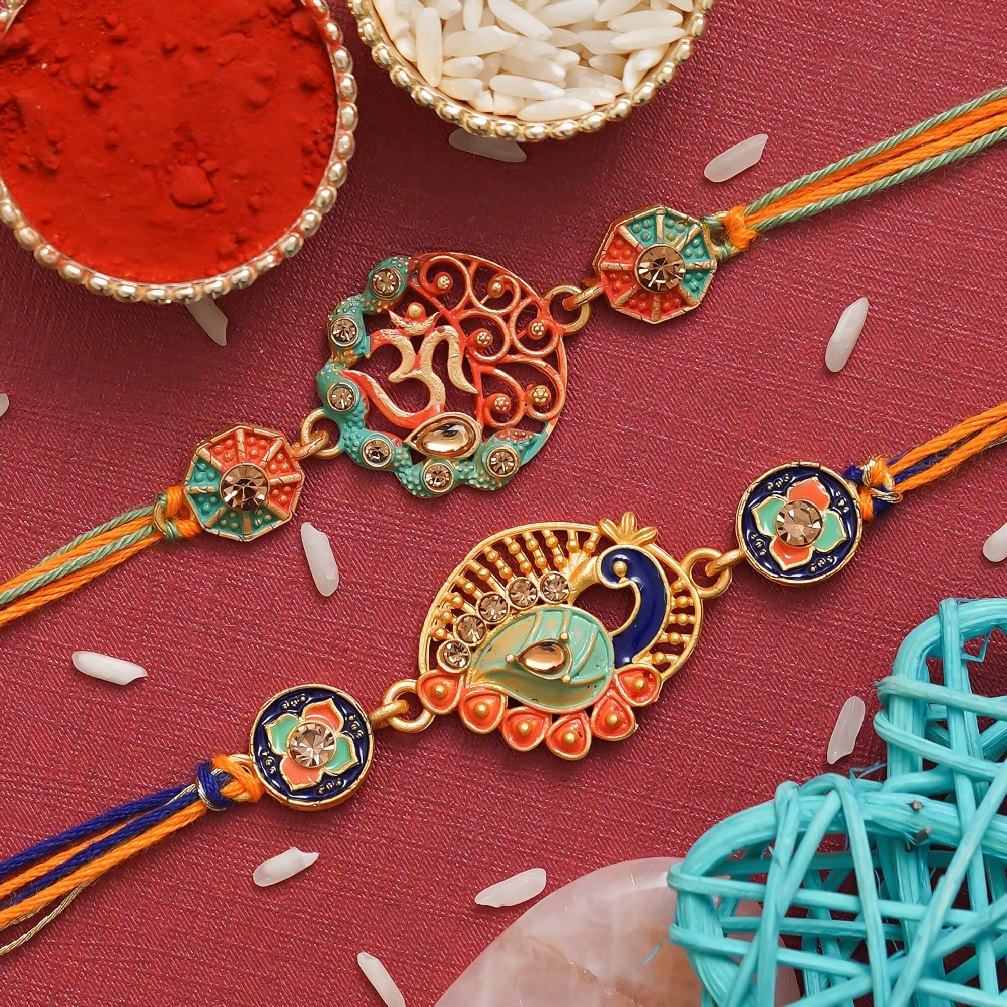 Ecraftindia Multicolor Set Of 2 Religious Om Symbol And Peacock Designer Rakhis With Roli Chawal Pack - Rakhis For Brothers
