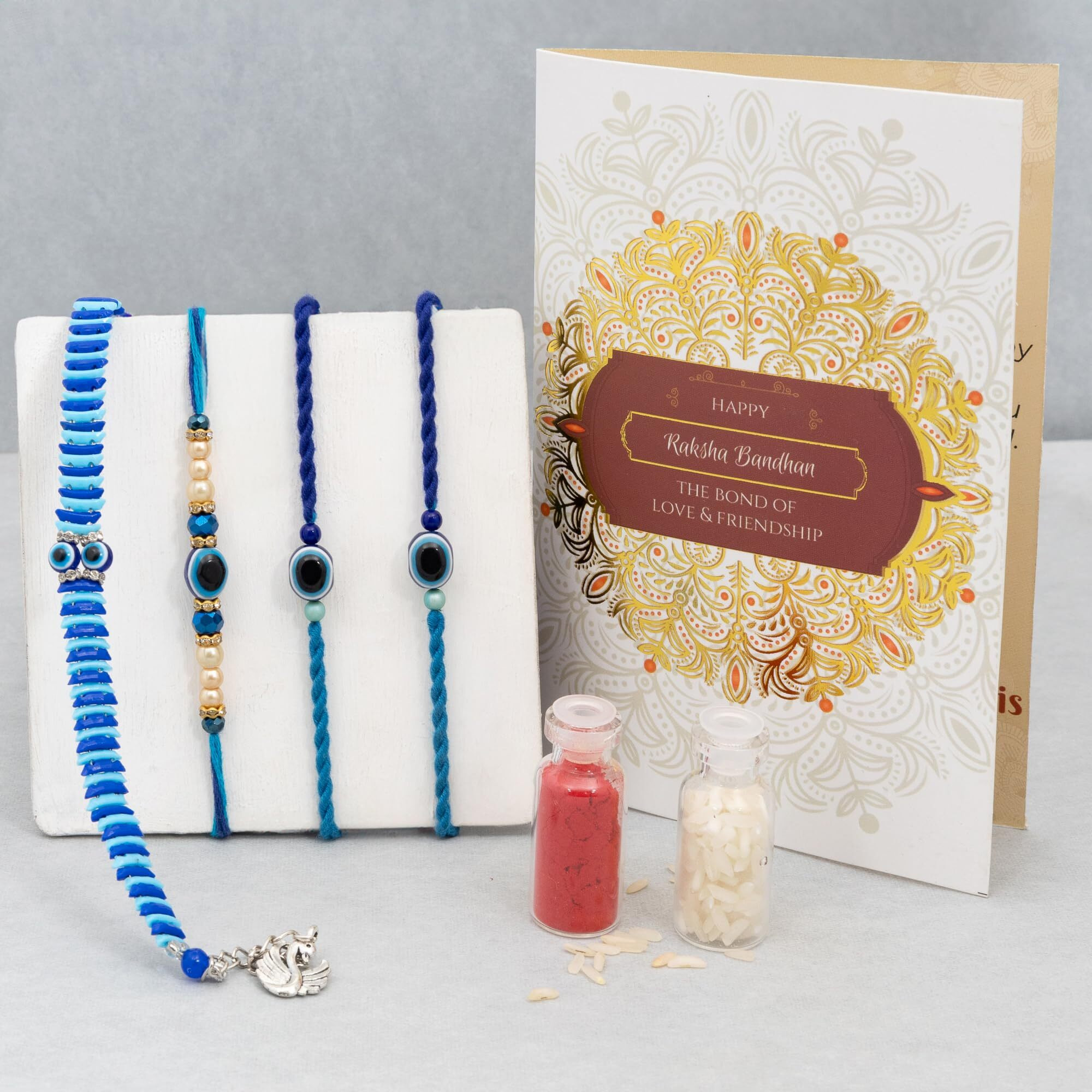 To The Nines Evil Eye Bhaiya Bhabhi Rakhi With 2 Kids Rakhi, Greeting Card & Tilak Material  Bracelet Rakhi Set