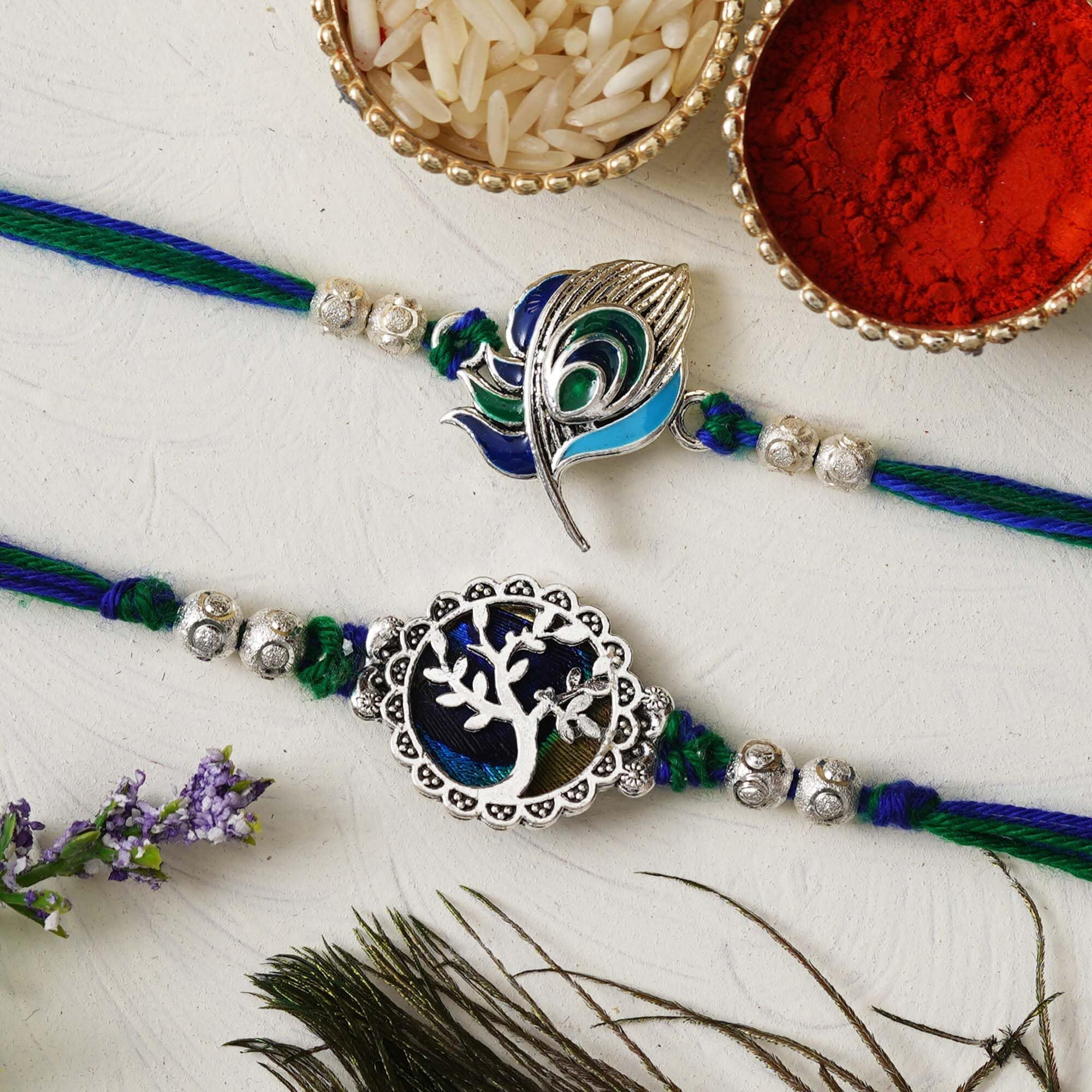 Ecraftindia Unisex Adult Set Of 2 Peacock Feather And Floral Designer Rakhis For Brothers With Roli Chawal Pack
