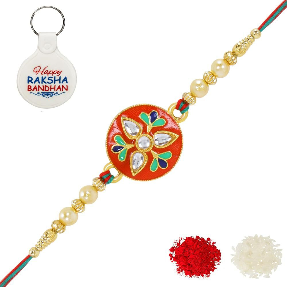 Riddhika Ventures Alluring Gold Plated Floral And Pearl Rakhi With Roli Chawal, Greeting Card And And One Motivational Keychain (P2K)