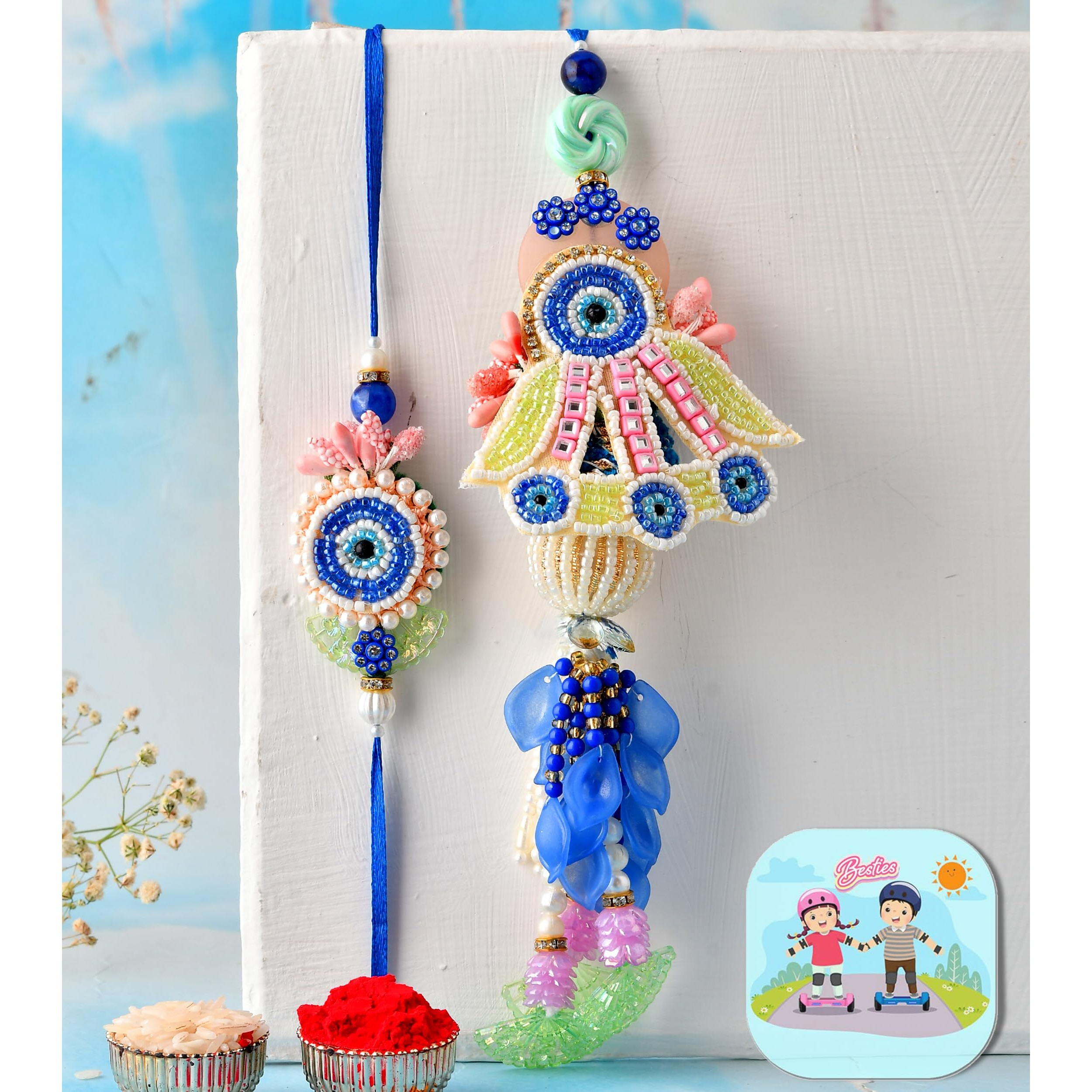 Craftvatika Premium Evil Eye Rakhi Set For Brother Bhabhi | Designer Rakhi Set For Bhaiya Bhabhi Evil Eye Lumba Couple Pair With Fridge Magnet Gift, Rakshabandhan Greeting Card, Tilak Set, Home Decor