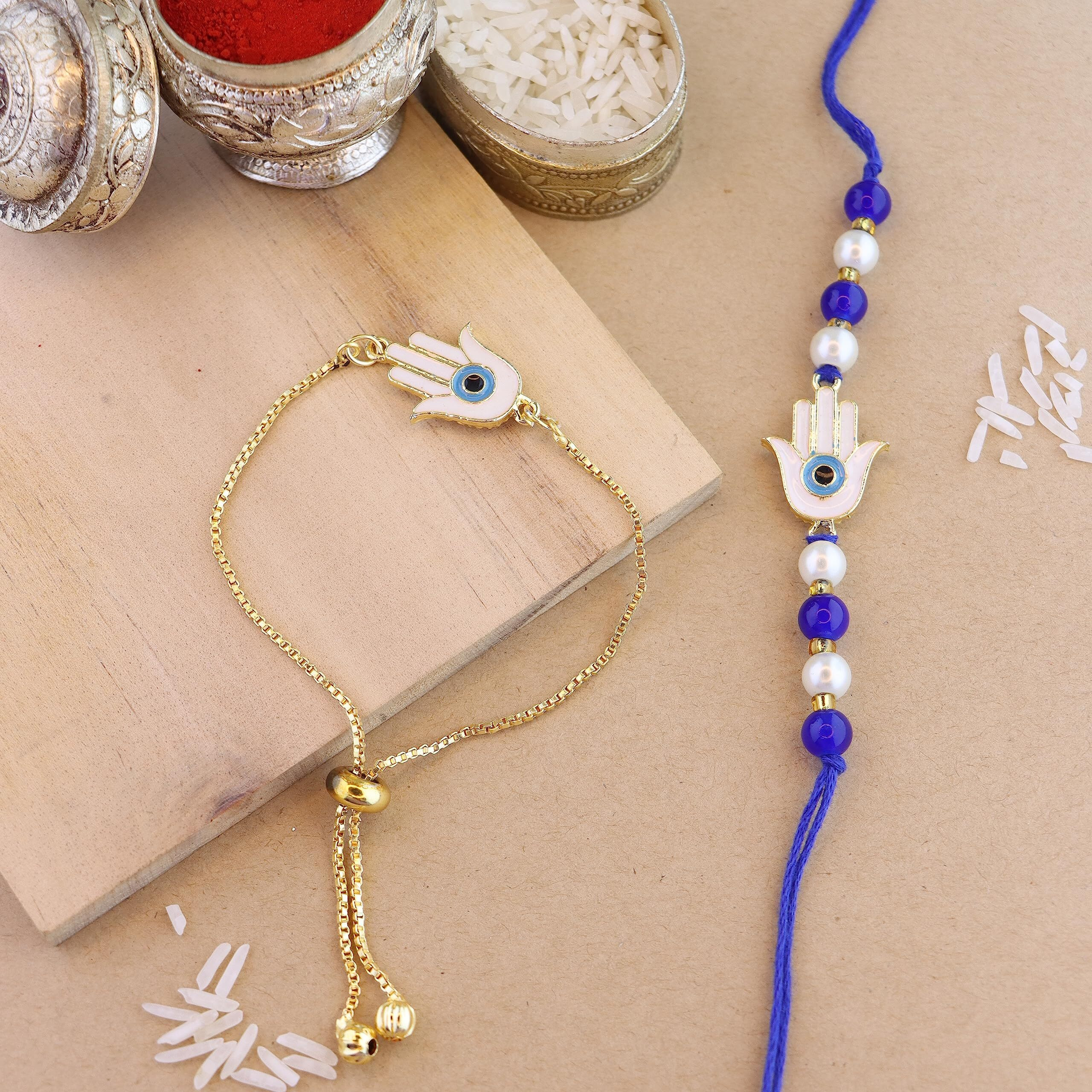 I Jewels Unisex-Adult Rakshabandhan Hamsa Shape Enamel Evil Eye Bhaiya Bhabhi Lumba Rakhi Combo Set With Roli Chawal (R126-Co)