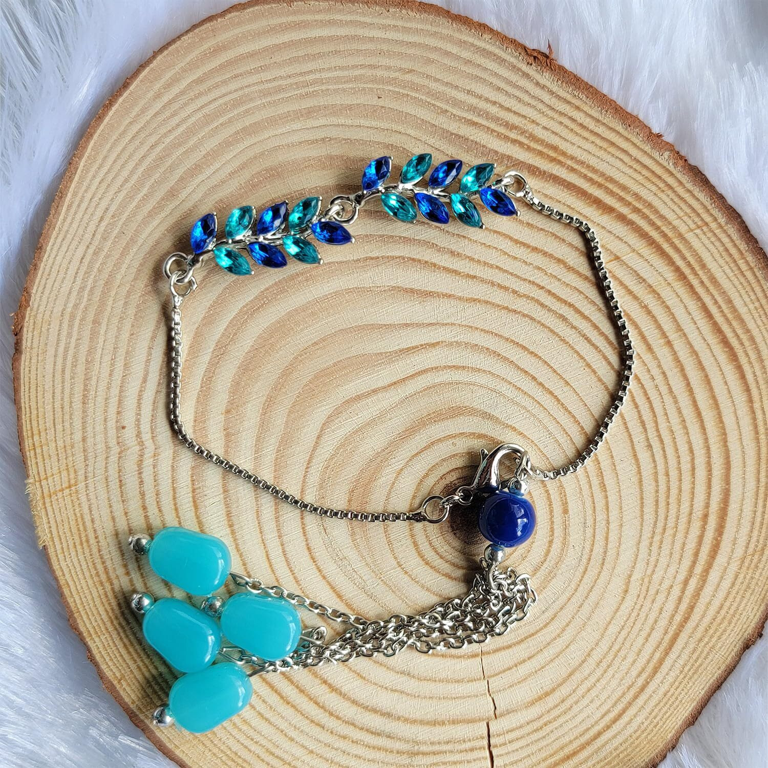 Mahi Light And Dark Blue Leafy Shape Crystals Lumba Rakhi For Bhabhi (Ral1100712Rblu)