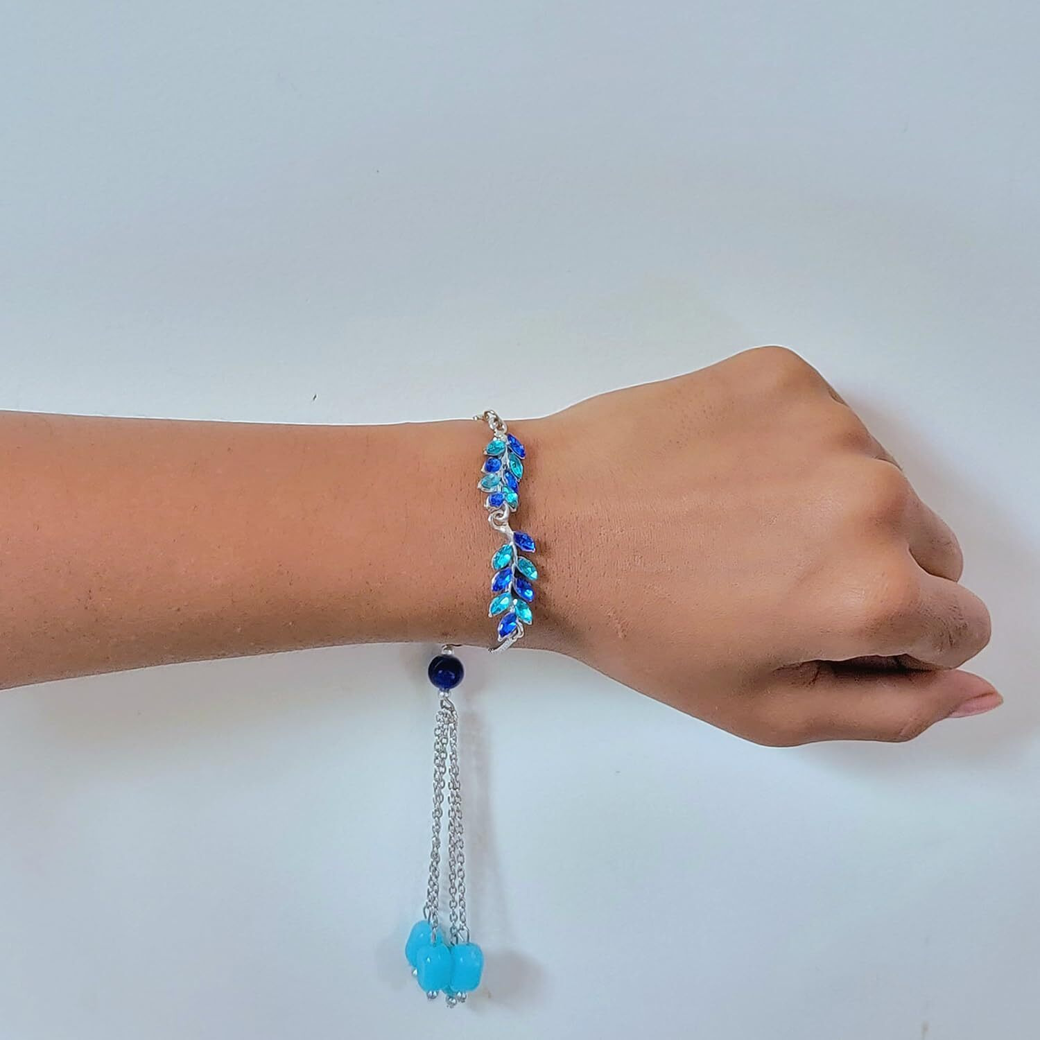 Mahi Light And Dark Blue Leafy Shape Crystals Lumba Rakhi For Bhabhi (Ral1100712Rblu)
