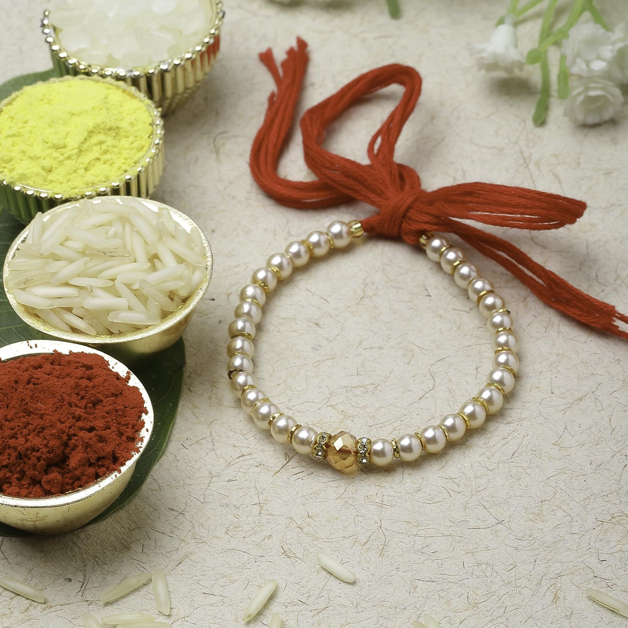 Zeneme Rakhi For Bhai Rakhi For Bhaiya Champagne Pearl Stringed In Red Thread Rakhi With Roli Chawal And Raksha Bandhan Greeting Card For Brother