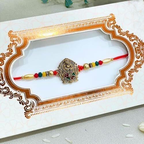 Chottey Lal And Sons Rakshabandhan Thread Ganesh Ji Rakhi With Roli Chawal || Traditional Colorful Designer Thread Rakhi For Brother And Sister (Pack Of 1, Multicolor)