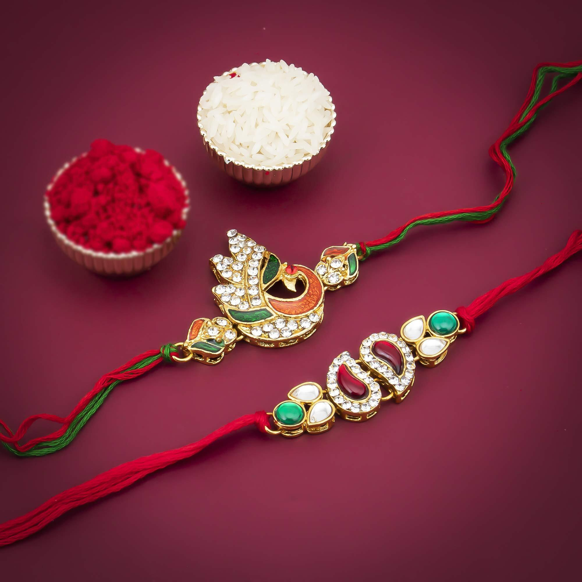 Sukkhi Rakhi Effervescent Kundan Rakhi Combo & Designer Gold Plated Premium Rakhi For Brother, Roli Chawal & Greeting Card|Rakhi For Bhaiya|Rakhi For Men|Kundan Rakhi|Rakhi Combo-Set Of 2 |Cb73469)
