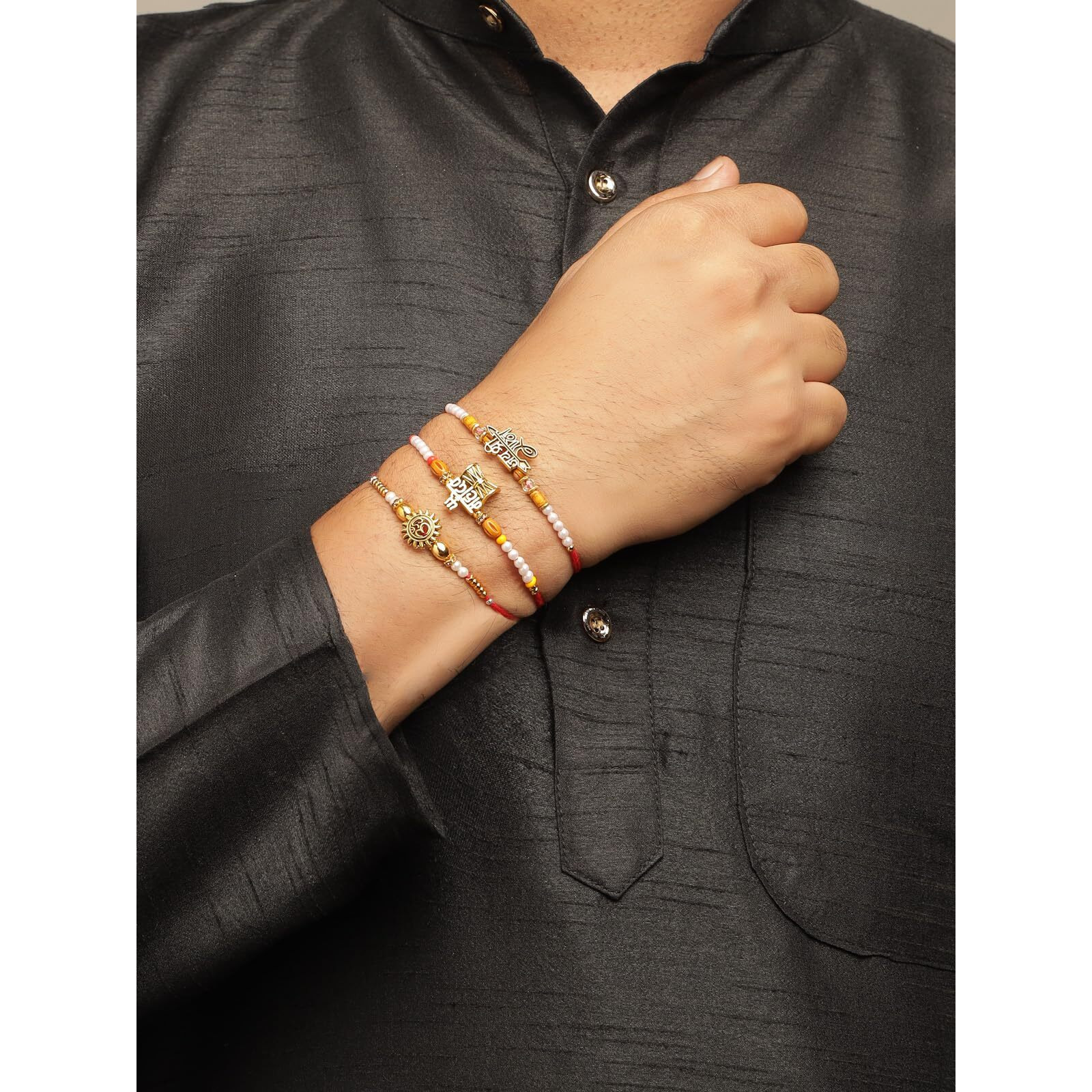 Sukkhi Rakhi Innovative Gold Plated Om Jay Shree Ram & Trishul With Damru Combo Rakhi For Brother With Roli Chawal & Greeting Card|Set Of 3|Cbrak107449
