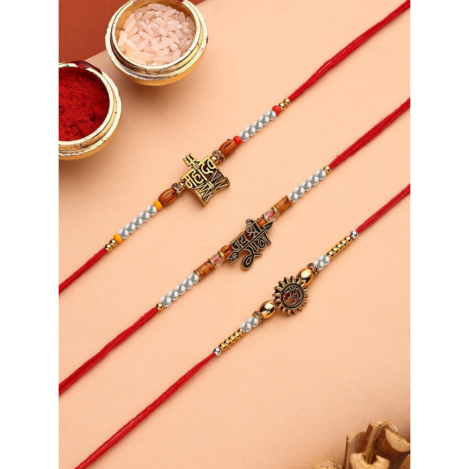 Sukkhi Rakhi Innovative Gold Plated Om Jay Shree Ram & Trishul With Damru Combo Rakhi For Brother With Roli Chawal & Greeting Card|Set Of 3|Cbrak107449