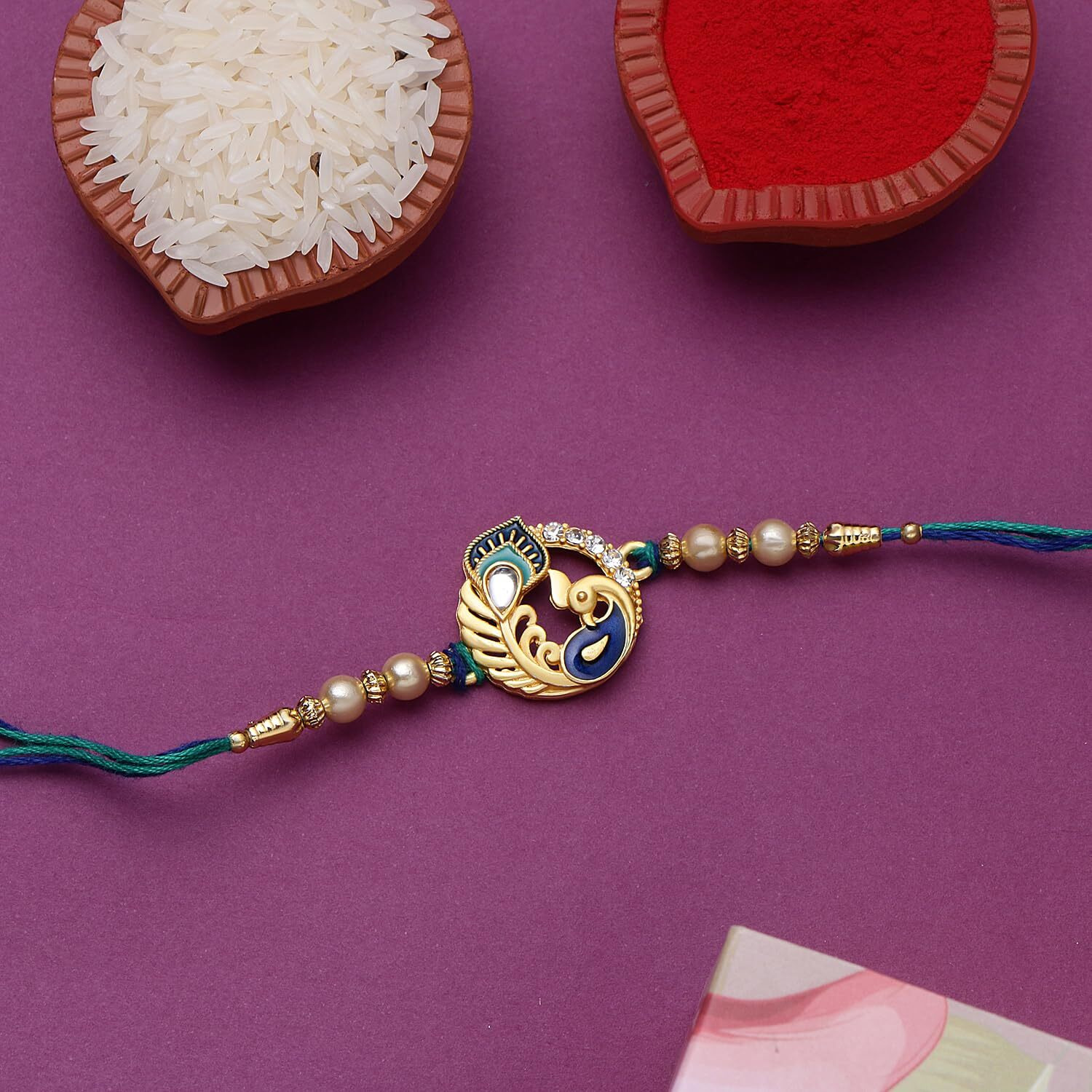 Riddhika Ventures Ritzy Gold Plated Meenakari Peacock Rakhi With Roli Chawal, Greeting Card And And One Motivational Keychain (P1K)