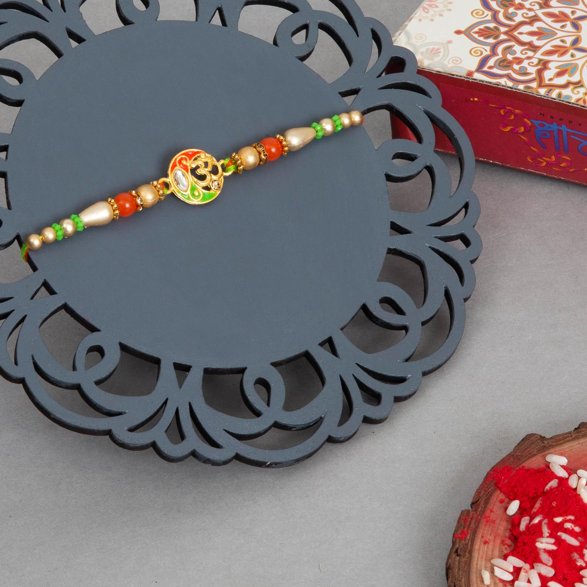 To The Nines Elegant Divine Rakhi/Band For Beloved Brother With Tilak Material (Gold2)