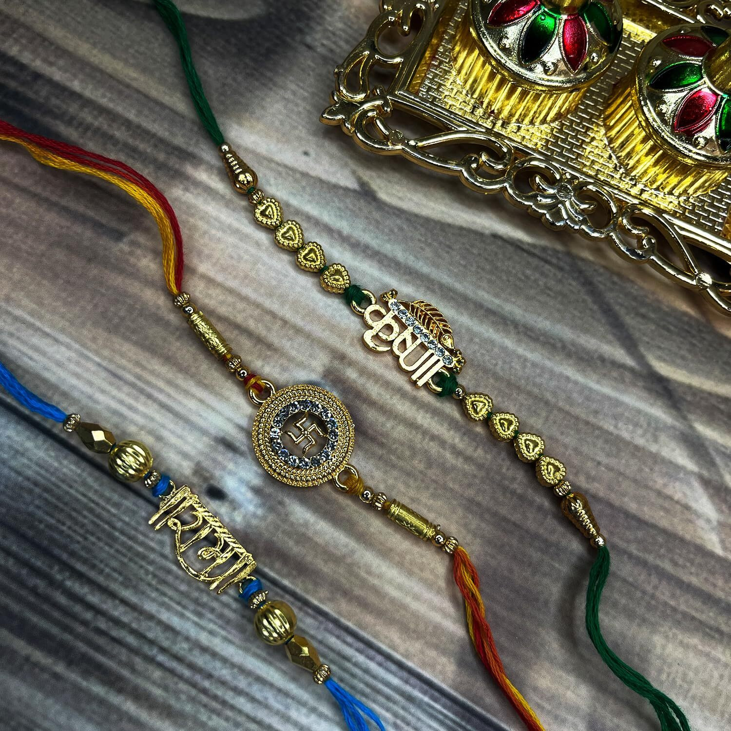 Mahi Gold Plated Religious Combo Of Swastik, Rama And Krushana Rakhi For Brother, Bhai, Bro (Rco1105713G)