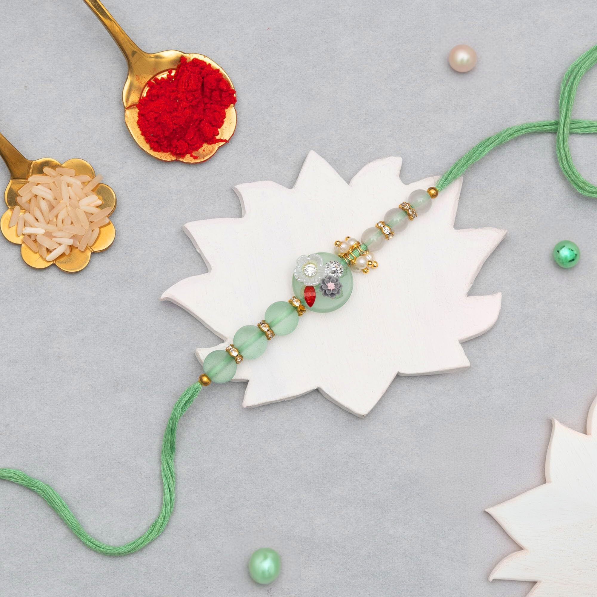 To The Nines Green Floral Rakhi For Brother With Tilak Material & Greeting Card
