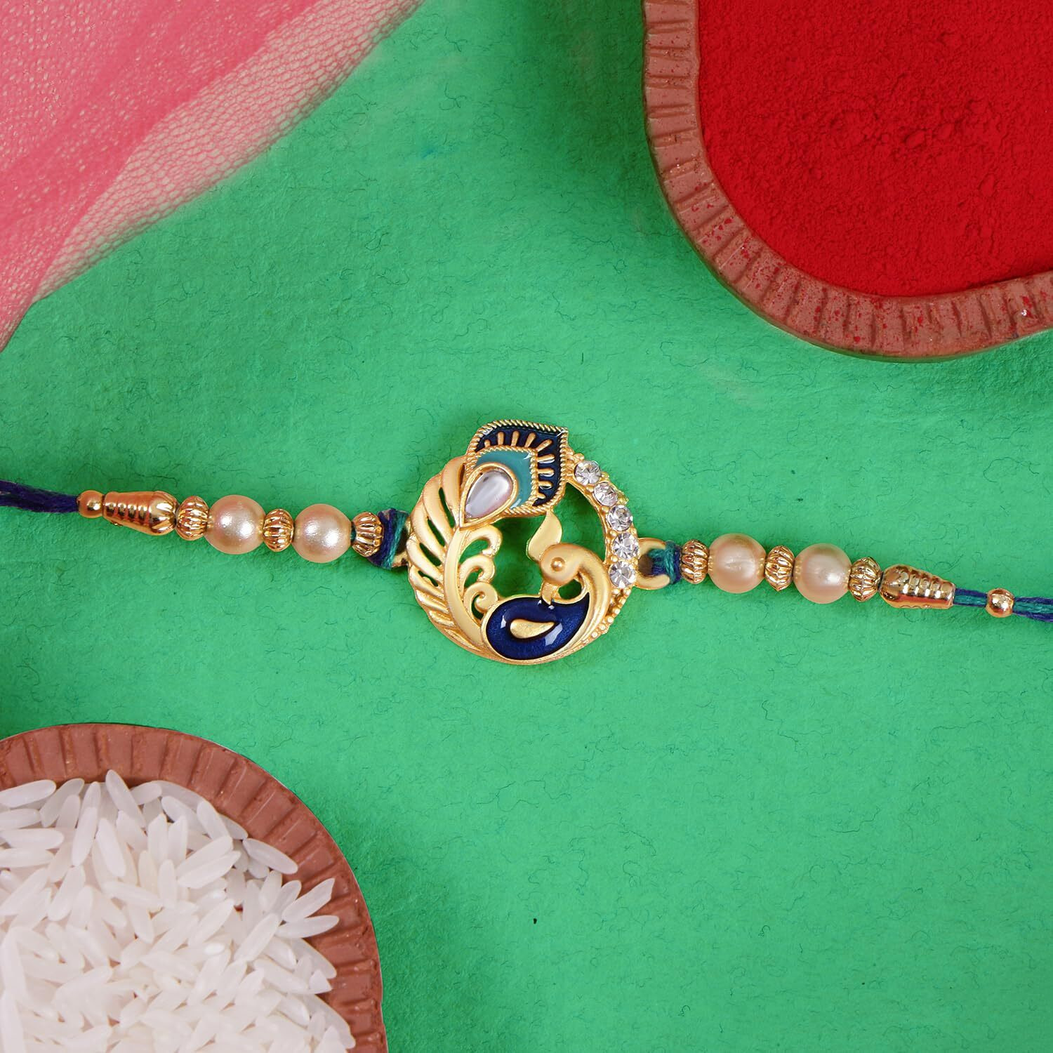 Riddhika Ventures Ritzy Gold Plated Meenakari Peacock Rakhi With Roli Chawal And Greeting Card (P1) (P1)