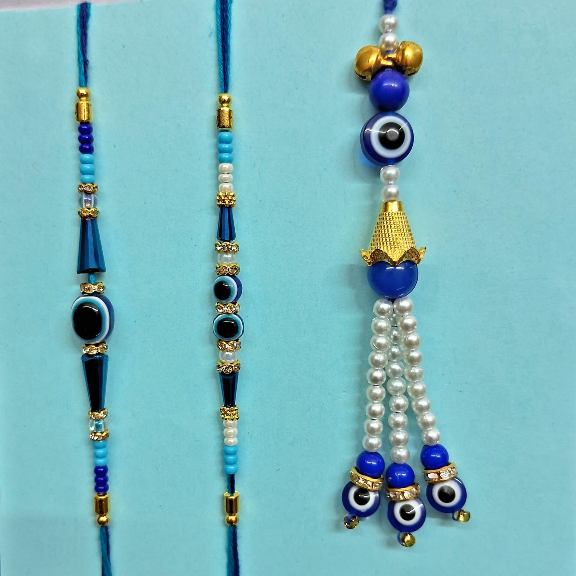 Alaukik Evil Eye Rakhi Family Combo For Bhaiya Bhabhi And Kids With Ganesh Idol, Rakhi With Chocolate For Brother Kids, Rakhi Set Of 3 With Chocolate Gift Pack, Tilak Set