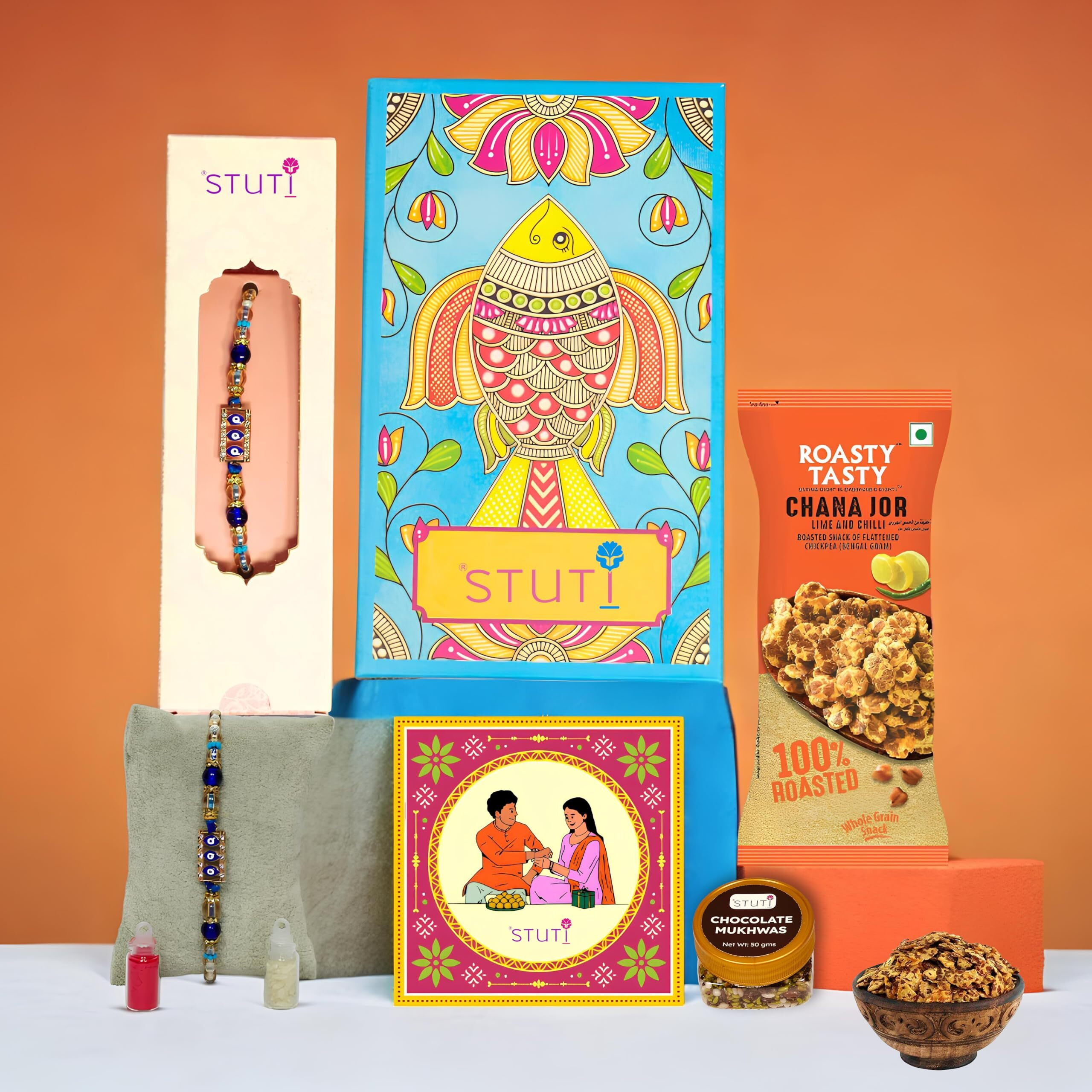 Stuti Rakhi Gift For Brother-5 Inclusions Combo Of Evil Eye Rakhi,Chocolate Mukhwas, Chana Jor Snacks, Personalized Greeting Card With Message-Complimentary Roli & Chawal - Tyohaar Hamper