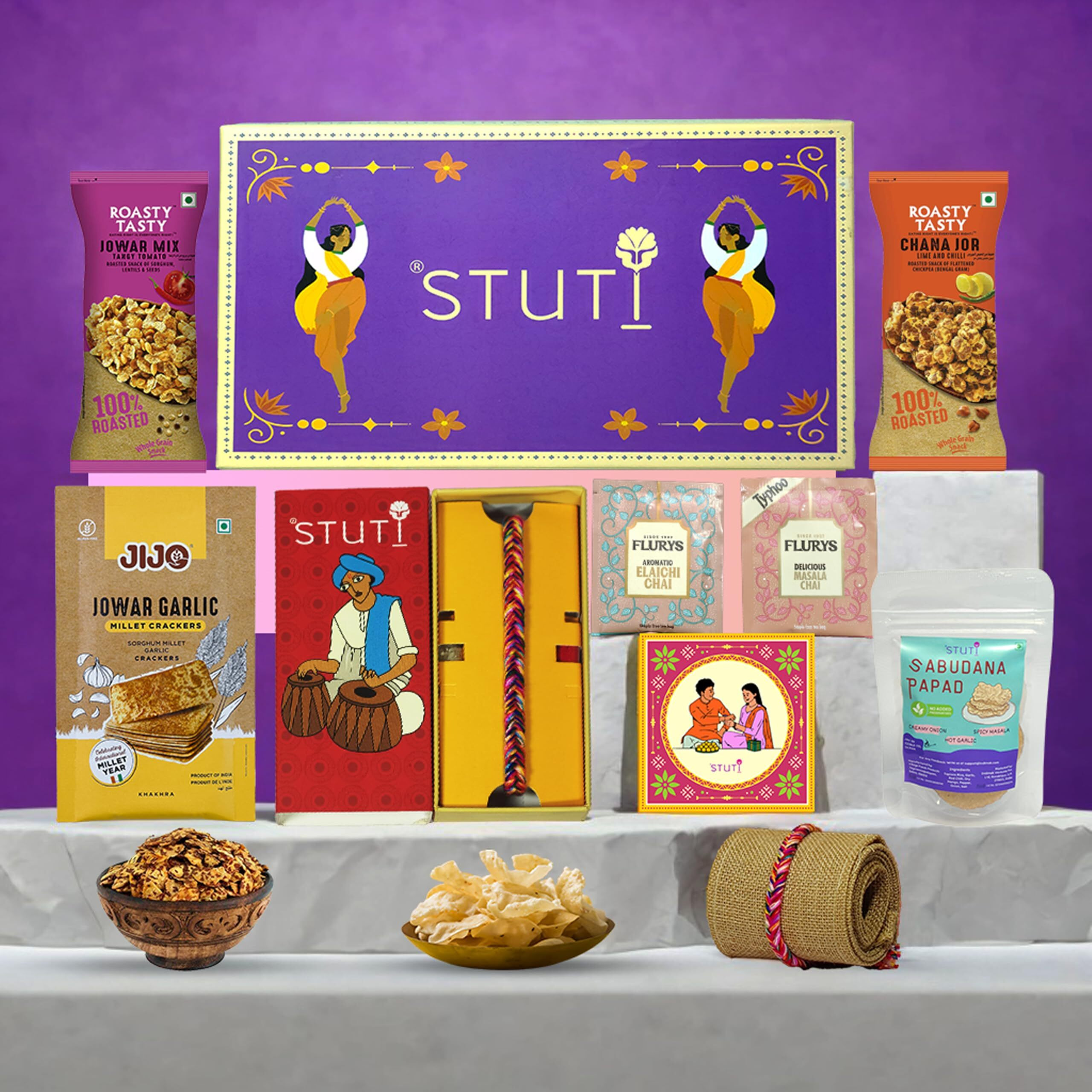 Stuti Yaadein Rakhi Gift For Brother-9 Inclusions Combo Of Handmade Cotton Dori, Sabudana Papad, Namkeen Snacks, Khakra, Chai And More With Complimentary Roli & Chawal | Rakhi Combo Gift Box
