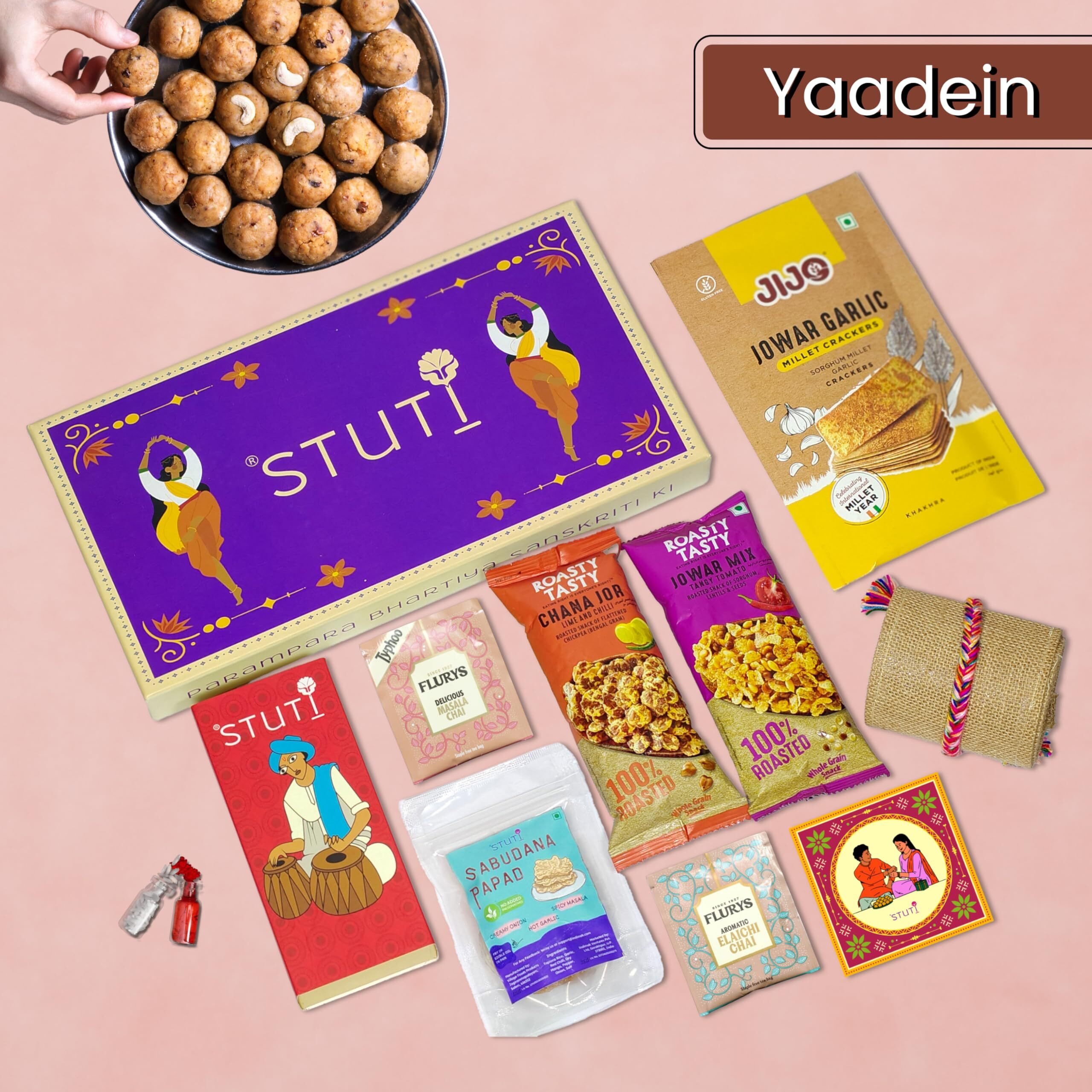 Stuti Yaadein Rakhi Gift For Brother-9 Inclusions Combo Of Handmade Cotton Dori, Sabudana Papad, Namkeen Snacks, Khakra, Chai And More With Complimentary Roli & Chawal | Rakhi Combo Gift Box