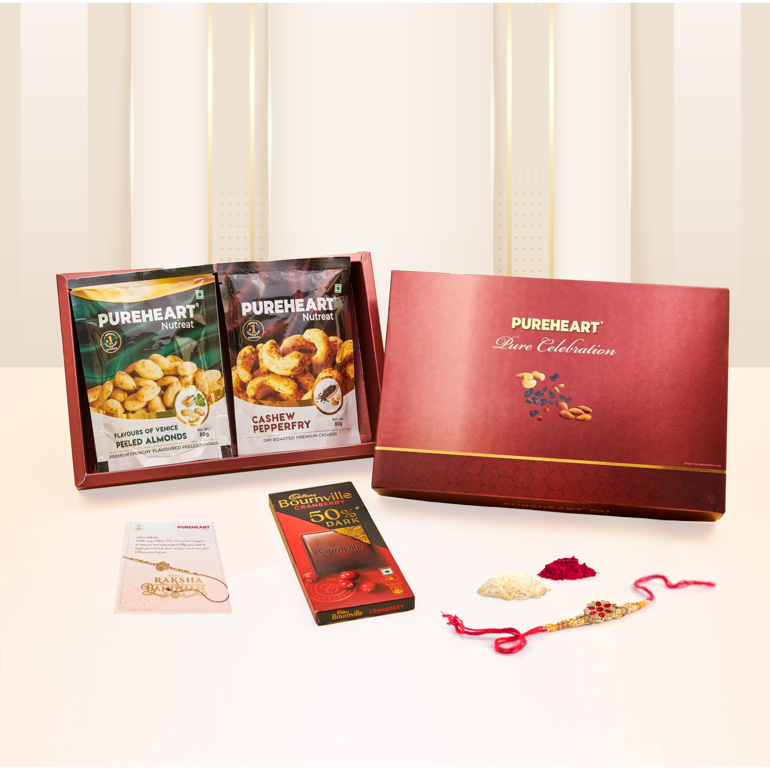 Pureheart Rakhi Gift Hamper Peeled Almonds Flavors Of Venice, Pepperfry Cashews (80G, Each), Cadbury Bournville Dark Chocolate With Rakhi For Brother, Gift Card, Pooja Rice, Kumkum
