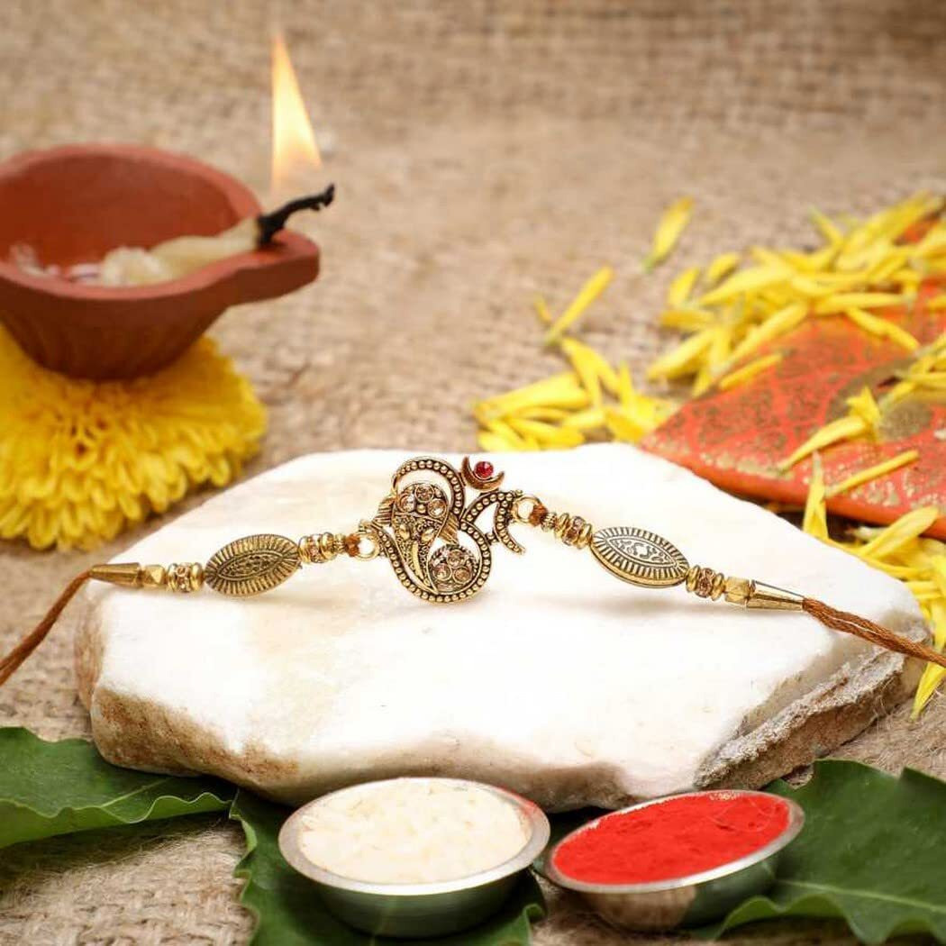 Ecraftindia Golden Lord Ganesha Om Designer Rakhi For Brother With Chocolate Gift, Ferrero Rocher Chocolate 16 Pcs, Rakhi With Chocolate - Roli Chawal Pack, Raksha Bandhan Greeting Card