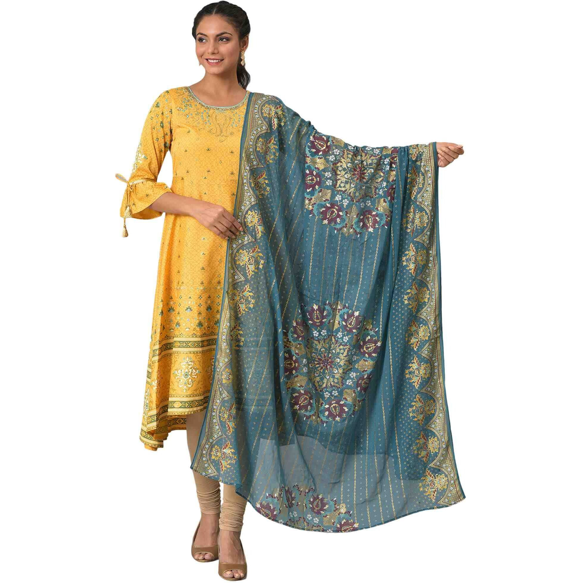 Get Yourself This Opulent Gold Foil Printed Chiffon Dupatta, With A Scallop Border For Outline And Running Stripes Through Entire Length. This Dupatta Compliments A Wide Variety Of Styles And It Will Be A Cheery On Top With Any Of Your Festive Looks.