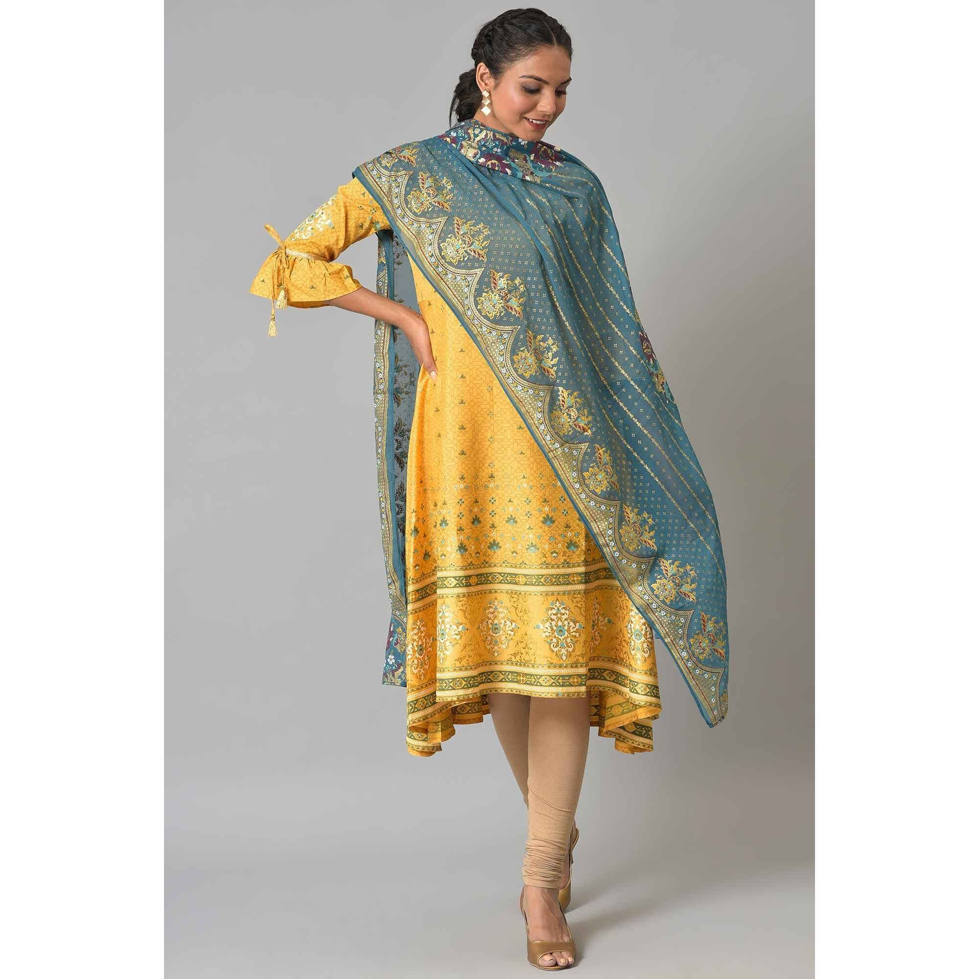 Get Yourself This Opulent Gold Foil Printed Chiffon Dupatta, With A Scallop Border For Outline And Running Stripes Through Entire Length. This Dupatta Compliments A Wide Variety Of Styles And It Will Be A Cheery On Top With Any Of Your Festive Looks.