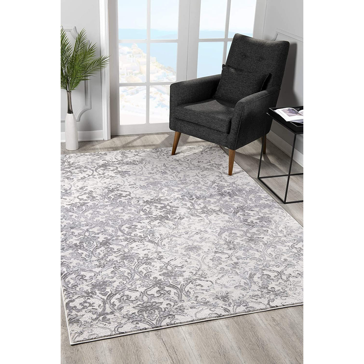 7 X 10 Cream And Gray Faded Filigree Area Rug