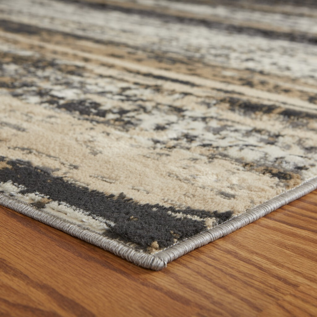5 X 7 Beige And Black Abstract Desert Area Rug