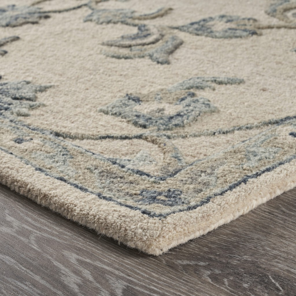 5 X 7' Beige And Blue Filigree Area Rug