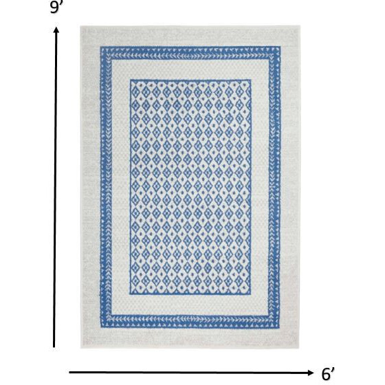 6 X 9 Ivory And Blue Geometric Area Rug