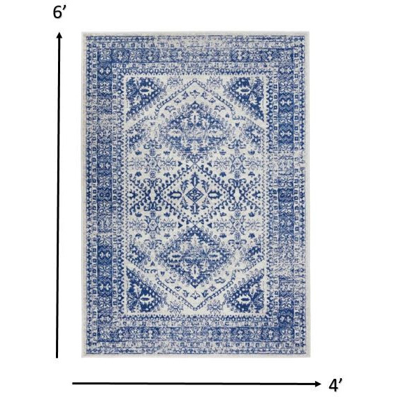 4 X 6 Ivory And Navy Geometric Area Rug