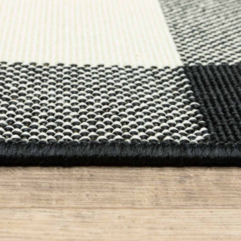 8 Round Black And Ivory Gingham Indoor Outdoor Area Rug