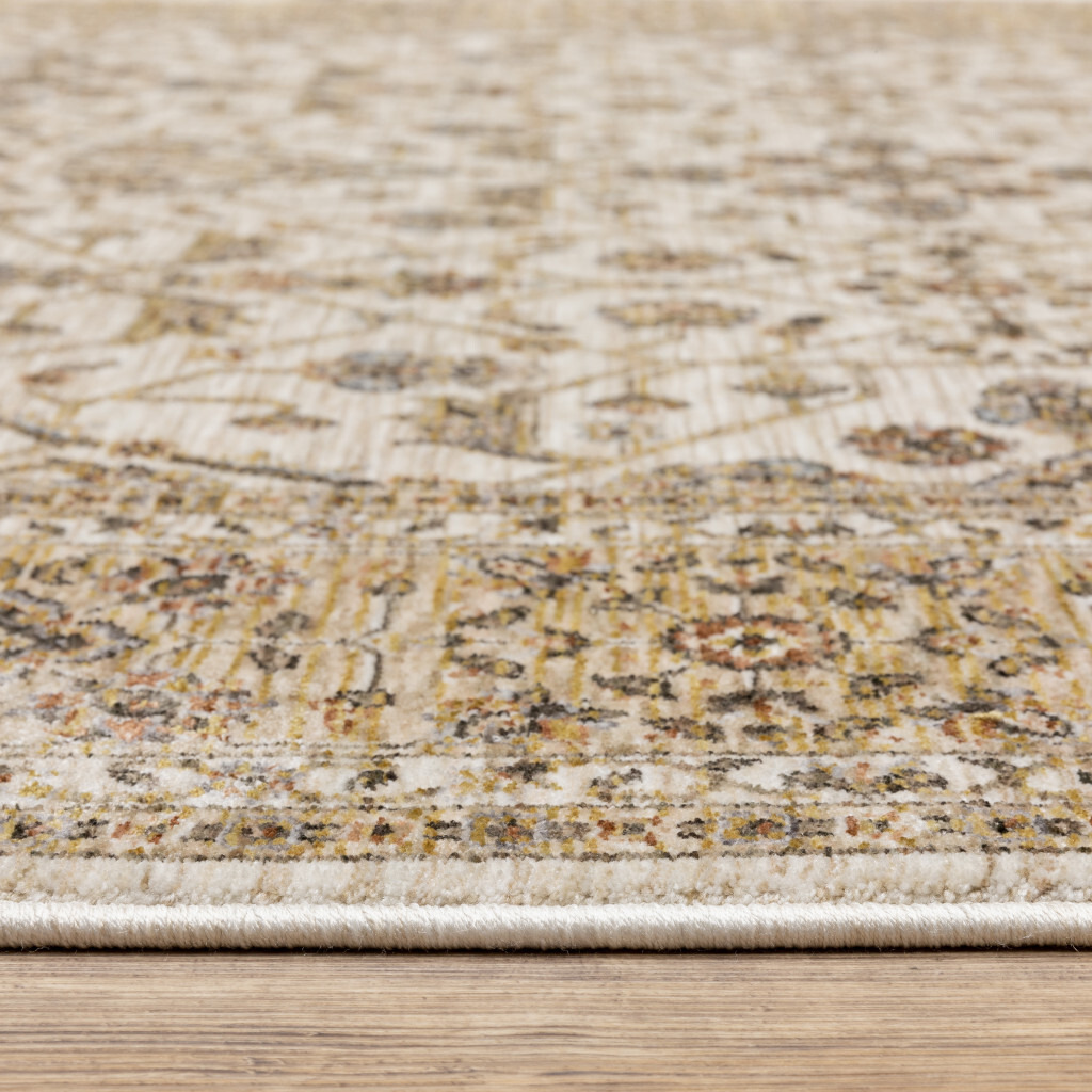 2 X 3 Ivory And gold Oriental Power Loom Stain Resistant Area Rug With Fringe