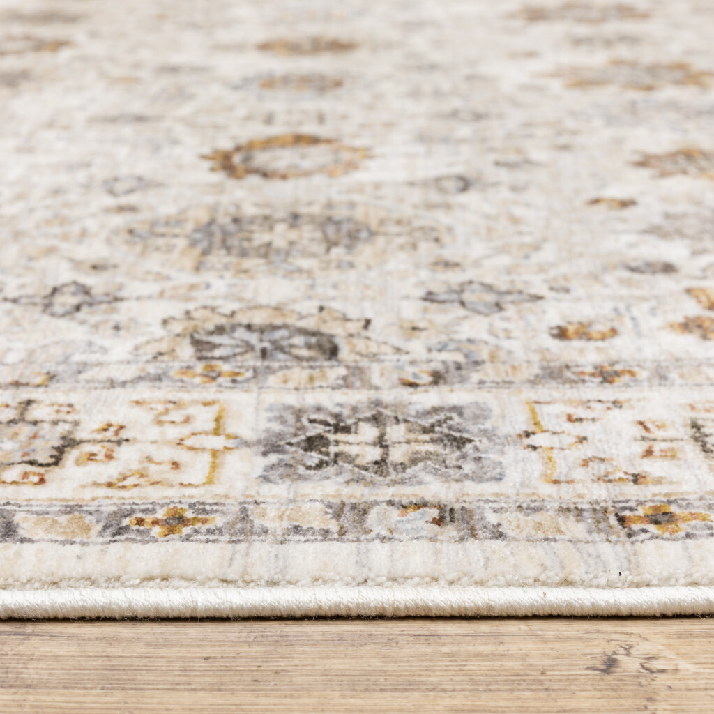 2 X 3 Ivory And gold Oriental Power Loom Stain Resistant Area Rug With Fringe