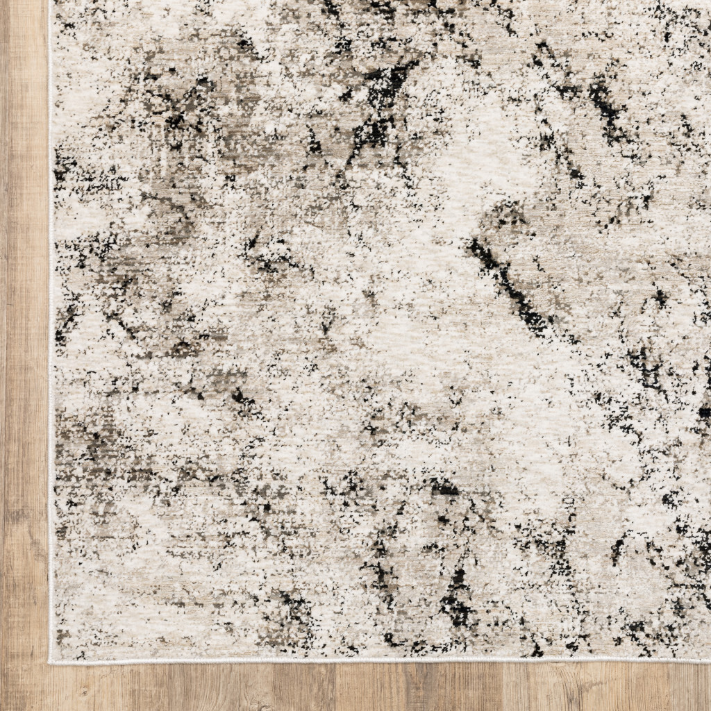 5 X 8 Ivory grey Black Beige And Tan Abstract Power Loom Stain Resistant Area Rug