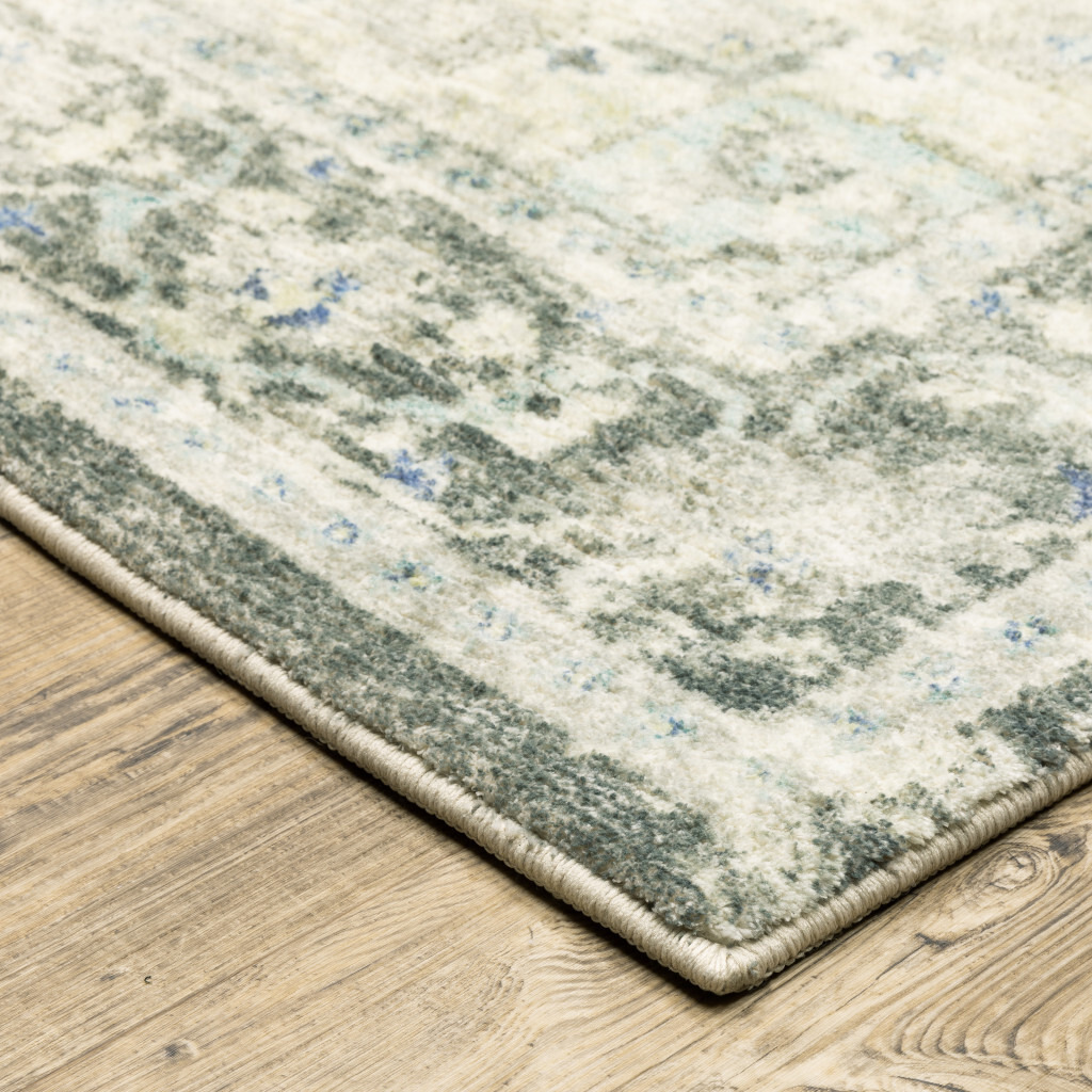 5 X 7 grey Ivory And Blue Oriental Power Loom Stain Resistant Area Rug