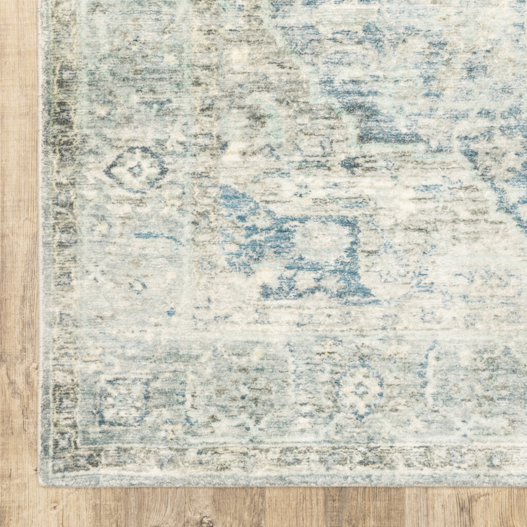 5 X 7 grey Blue And Ivory Oriental Power Loom Stain Resistant Area Rug