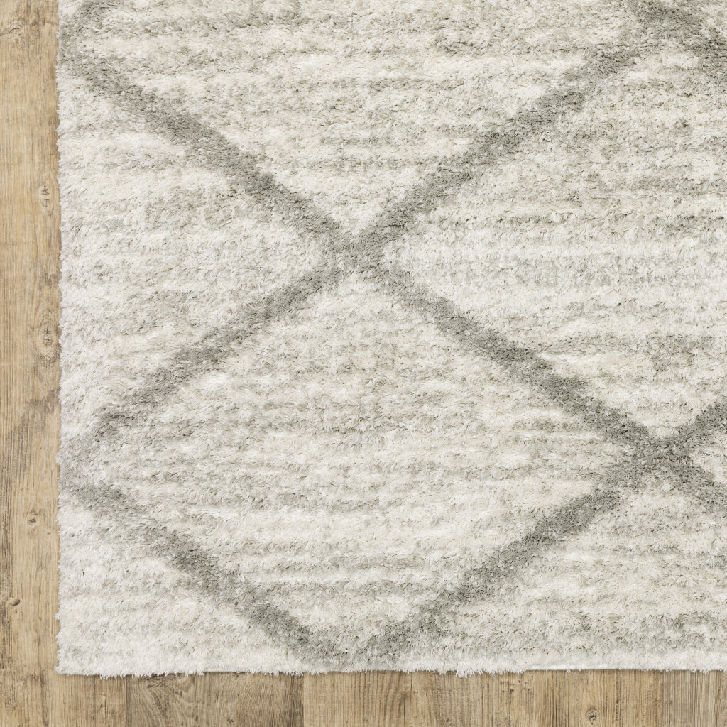 5 X 8 Ivory And grey geometric Shag Power Loom Stain Resistant Area Rug