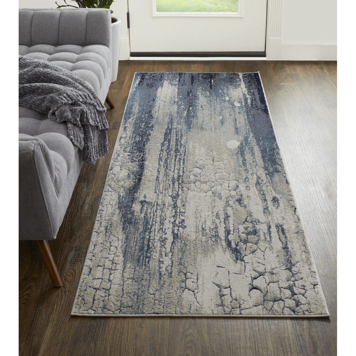 8 Ivory Blue And Black Abstract Power Loom Distressed Runner Rug