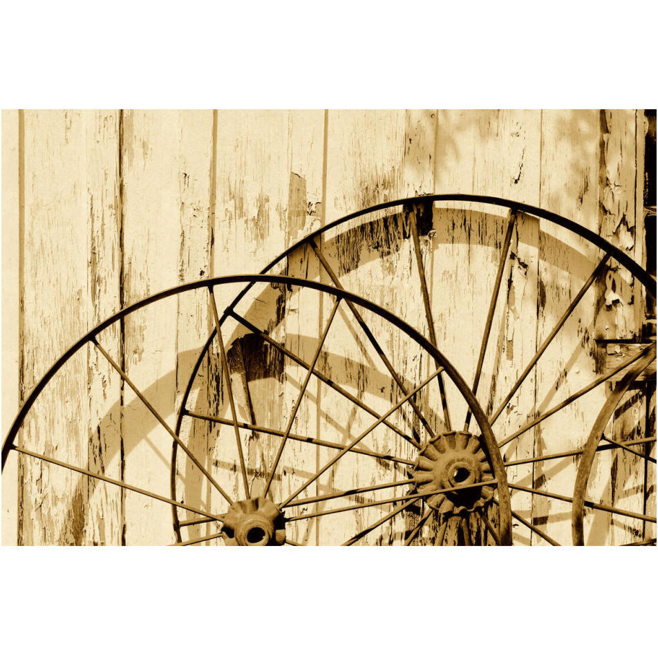 Old wagon wheels against a shed in Buffalo Gap Historic Village, near Abilene, TX - Sepia-Paper Art-20&quotx14"