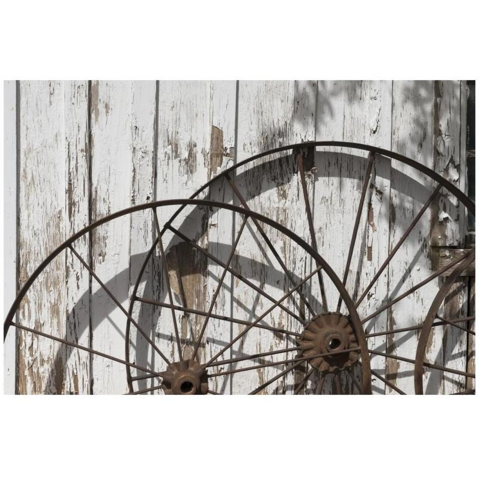 Old wagon wheels against a shed in Buffalo Gap Historic Village, near Abilene, TX-Paper Art-32&quotx22"