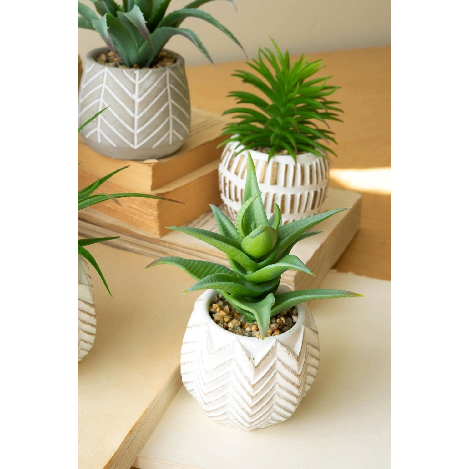 SET OF SIX ARTIFICIAL SUCCULENTS IN CEMENT POTS