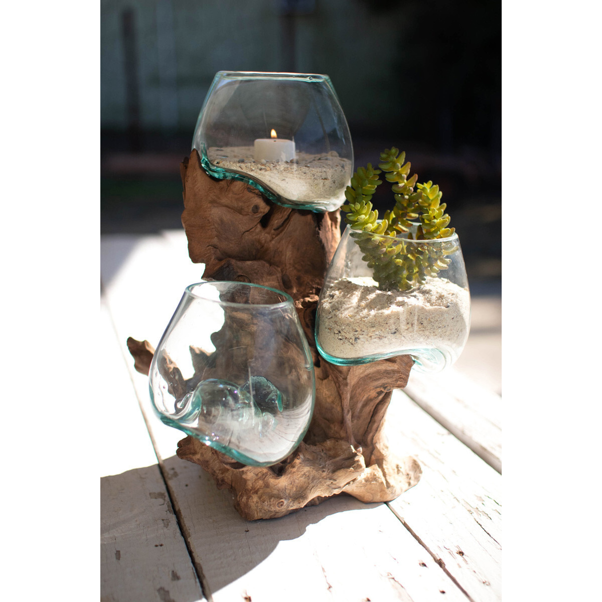 THREE BLOWN GLASS BOWLS ON A DRIFTWOOD BASE